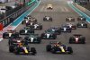 ABU DHABI, UNITED ARAB EMIRATES - NOVEMBER 20: Max Verstappen of the Netherlands driving the (1) Oracle Red Bull Racing RB18 and Sergio Perez of Mexico driving the (11) Oracle Red Bull Racing RB18 lead the field into turn one at the start during the F1 Grand Prix of Abu Dhabi at Yas Marina Circuit on November 20, 2022 in Abu Dhabi, United Arab Emirates. (Photo by Mark Thompson/Getty Images) // Getty Images / Red Bull Content Pool // SI202211202238 // Usage for editorial use only //